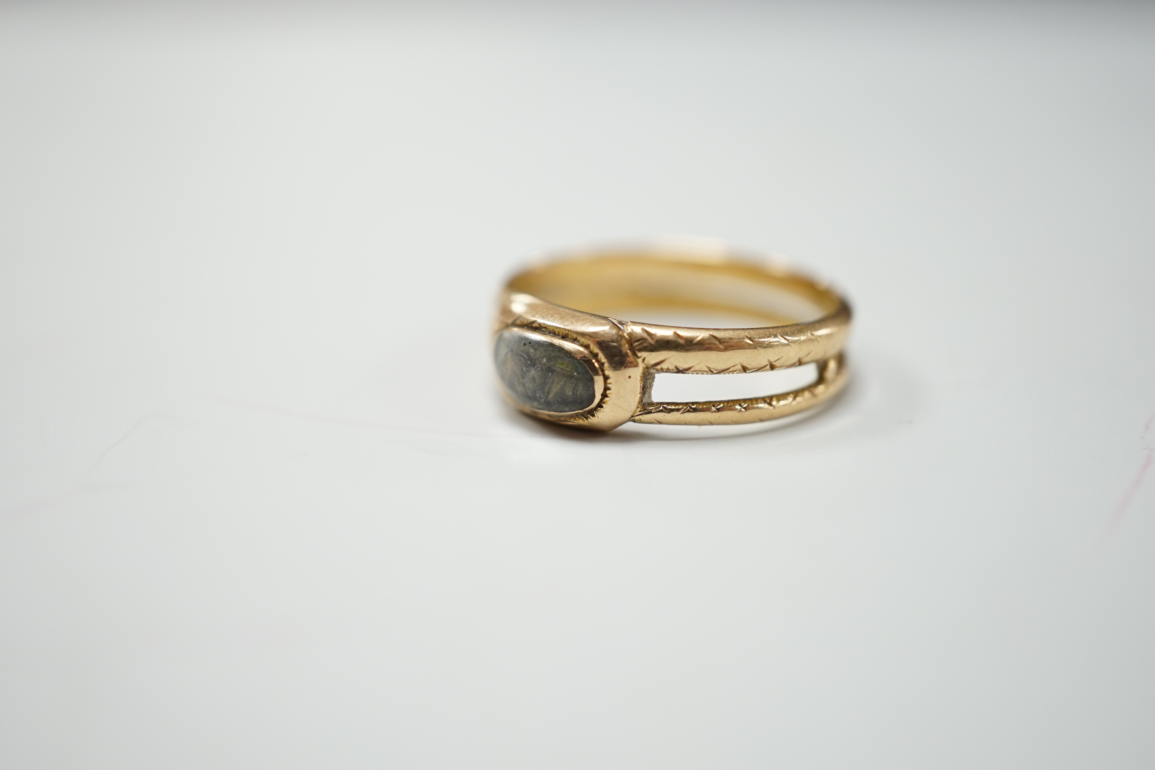 An early 19th century gold memorial ring, with small hairwork panel and inscription for Mary Goodwyn, Obt.30 Nov 1816 Aet 85, size N, gross 3.2 grams